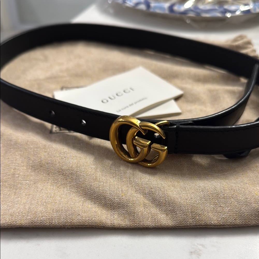 Gucci Black and Gold Designer Belt with Iconic Logo